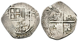 FELIPE II. 2 reales. 15--. Sevilla. Ensayador no visible. AR 6,77 g. 26,2 mm. AC-tipo 137. Amplios vanos. MBC.