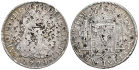 CARLOS III. 8 reales. 1774. México. FM. AR 26,7 g. 39,7 mm. VI-935. Múltiples resellos orientales. MBC-.