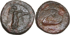Greek Italy. Southern Apulia, Brundisium. AE 1/8 Uncia, c. 215 BC. Obv. Nike advancing right, holding wreath and palm. Rev. Dolphin left; L above. HN ...