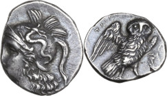 Greek Italy. Southern Apulia, Tarentum. AR Drachm, c. 281-272 BC. Obv. Head of Athena left with hair flowing down behind. Rev. Owl standing on thunder...