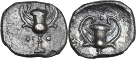 Greek Italy. Southern Apulia, Tarentum. AR Obol, c. 280-228 BC. Obv. Kantharos surrounded by three pellets. Rev. Kantharos; kerykeion to left, four pe...
