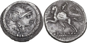 L. Torquatus. AR Denarius, 113 or 112 BC. Obv. Helmeted head of Roma right; behind, ROMA (MA ligate); below chin, X; torque as border. Rev. Warrior ga...