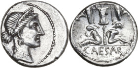 Julius Caesar. AR Denarius, Spain, 46-45 BC. Obv. Head of Venus right, wearing diadem; Cupid on shoulder. Rev. Trophy with oval shield and carnyx in e...