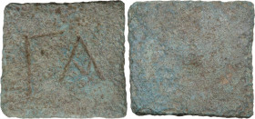 Byzantine Square Commercial Weight for 1 Ounce, 6th century. Obv. Engraved large Γ A. Rev. Blank. Cf. Bendall 78. AE. 19.58 g. VF.