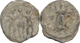 The Roman Empire. PB Tessera. D/ Three standing figures facing. R/ Modius. PB. 2.97 g. 17.00 mm.