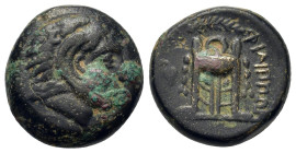 Macedon, Philippi, c. 356-345 BC. Æ (16mm, 6,70g). Head of Herakles left, wearing lion’s skin headdress. R/ Tripod; ivy leaf in left field. Bellinger,...