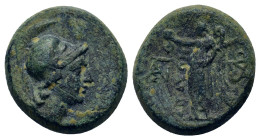 Aeolis, Aigai, c. 200 BC. Æ (15,2mm 4,60g). Helmeted head of Athena right. R/ ΑΙΓΑΕΩΝ Nike standing left wearing laurel wreath and palm between two mo...