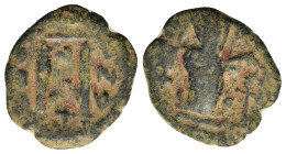 Constans II (641-668). Æ 40 Nummi (18mm, 3.00g). Constantinople, uncertain year. Constans standing facing, holding long cross and globus cruciger. R/ ...