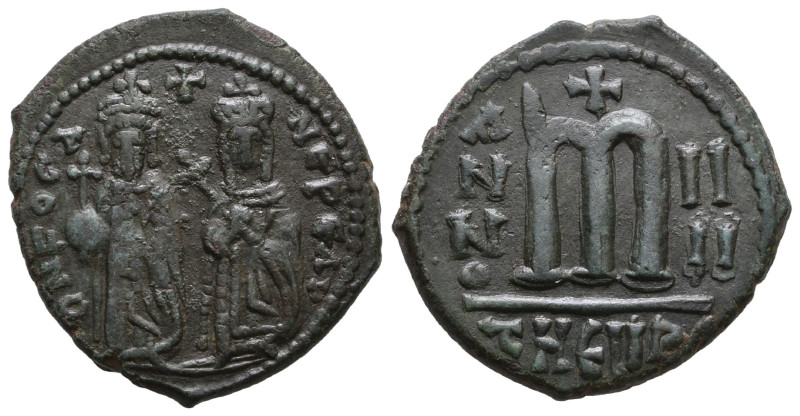 FOCAS 602-610. AE-Follis 607/608) AD Theupolis. Focas and Leontia stand in regal...