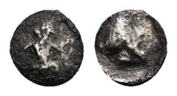 Achaemenid Empire. Uncertain mint. Uncertain Satrap. AR Tetartemorion, 0.10 g 5.84 mm. 500-400 BC.
Obv: Persian king or hero in kneeling-running stanc...