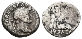Vespasian, AD 69-79. AR, Denarius. 3.20 g. 18.71 mm. Rome. Judaea Capta commemorative.
Obv: [IMP CAES]AR VESPAS[IANVS AVG]. Head of Vespasian, laureat...