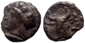 Mysia, Kyzikos AR Hemiobol, (Silver, 0.31 g 7mm) ca 410-400 BC.
Obv: Head of Attis left, wearing Phrygian cap; below, tunny left.
Rev: [KYZI], Head an...