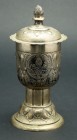 Early 20th Century German Silver Lidded Goblet with Two German Talers. From the Augsburg Schmedding Co. a German silver lidded goblet boasting two 18t...