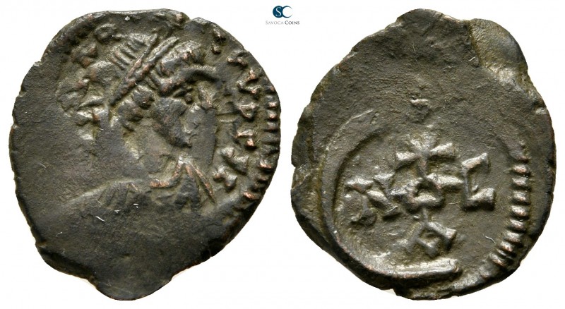 Justinian I AD 527-565. Theoupolis (Antioch)
Pentanummium Æ

17 mm., 1,67 g....