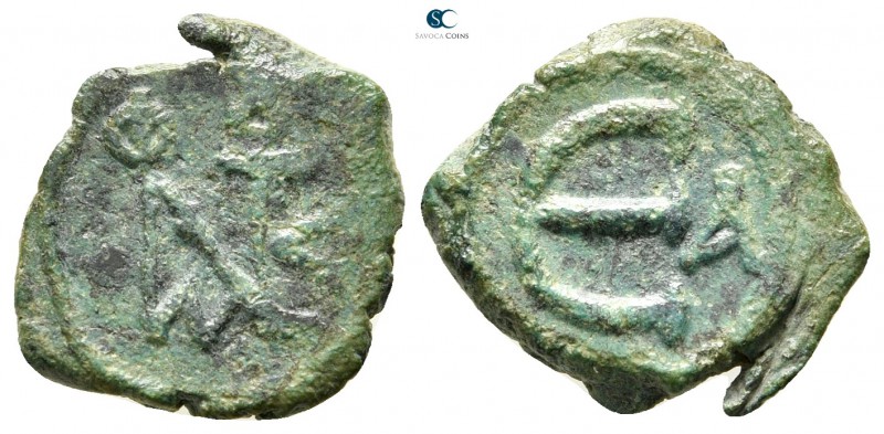 Justin II AD 565-578. Constantinople
Pentanummium Æ

16 mm., 2,08 g.



v...