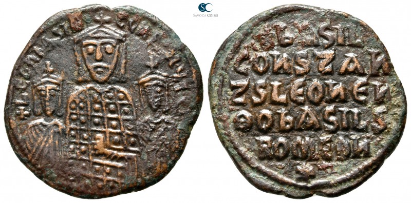 Basil I, with Leo VI and Constantine VII AD 867-886. Constantinople
Follis Æ
...