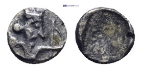Greek Persia. Achaemenid Empire. Time of Darios I to Xerxes II 485-420 BC. Tetartemorion AR 
(0.14 Gr. 5mm.) 
Head of the Persian Great King right 
Re...