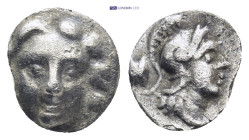 Pisidia. Selge circa 350-300 BC. Obol AR (0.79 Gr. 10mm.) 
Gorgoneion. 
Rev. Head of Athena to right, wearing crested Attic helmet; behind, astragalos...