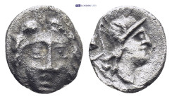Pisidia. Selge circa 350-300 BC. Obol AR (0.7 Gr. 9mm.) 
Gorgoneion. 
Rev. Head of Athena to right, wearing crested Attic helmet; behind, astragalos.