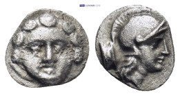 Pisidia. Selge circa 350-300 BC. Obol AR (0.96 Gr. 11mm.) 
Gorgoneion. 
Rev. Head of Athena to right, wearing crested Attic helmet; behind, astragalos...