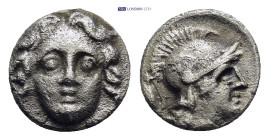Pisidia. Selge circa 350-300 BC. Obol AR (0.88 Gr. 9mm.) 
Gorgoneion. 
Rev. Head of Athena to right, wearing crested Attic helmet; behind, astragalos.