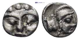 Pisidia. Selge circa 350-300 BC. Obol AR (0.86 Gr. 9mm.) 
Gorgoneion. 
Rev. Head of Athena to right, wearing crested Attic helmet; behind, astragalos.