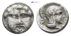Pisidia. Selge circa 350-300 BC. Obol AR (0.96 Gr. 9mm.) 
Gorgoneion. 
Rev. Head of Athena to right, wearing crested Attic helmet; behind, astragalos.