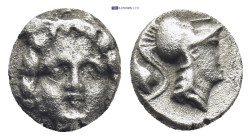 Pisidia. Selge circa 350-300 BC. Obol AR (0.9 Gr. 9mm.) 
Gorgoneion. 
Rev. Head of Athena to right, wearing crested Attic helmet; behind, astragalos.
