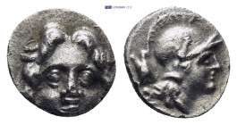 Pisidia. Selge circa 350-300 BC. Obol AR (0.84 Gr. 10mm.) 
Gorgoneion. 
Rev. Head of Athena to right, wearing crested Attic helmet.