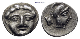 Pisidia. Selge circa 350-300 BC. Obol AR (0.89 Gr. 11mm.) 
Gorgoneion. 
Rev. Head of Athena to right, wearing crested Attic helmet.