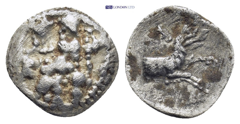 LYCAONIA. Laranda. Circa 324/3 BC. Obol (0.58 Gr. 11mm.). 
Baal seated left, hol...