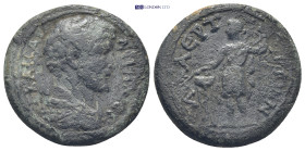 Antoninus Pius. AD 138-161. AE (9.9 Gr. 25mm.). 
Laureate head right 
Rev. Apollo Sidetes standing facing, head left, holding laurel branch and long s...