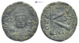 Justinian I (527-565 AD). Nicomedia AE Half Follis (22mm, 5.13 g) Obv: Helmeted and cuirassed bust facing, holding globus cruciger and shield decorate...