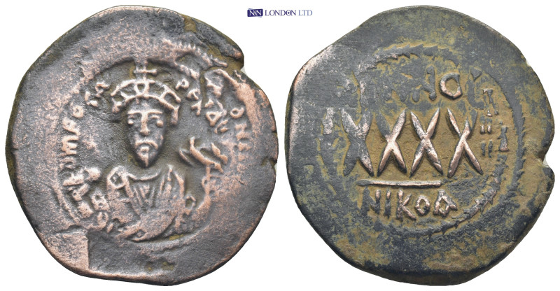 Phocas, 602-610. Follis Nicomedia (11.9 Gr. 34mm.)
Crowned bust of Phocas facing...