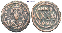 Phocas (602-610 AD). Constantinople. AE Follis (10 Gr. 30mm.) 
Crowned bust of Phocas facing, wearing consular robes, holding mappa in his right hand ...