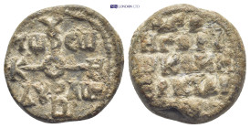 Byzantine Lead Seal (22.44 Gr. 26mm.). Obv: Cruciform monogram Rev: Legends in four lines.