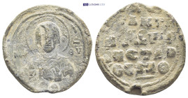 Byzantine Lead Seal (8.5 Gr. 24mm.). Obv: MP - ΘV. Nimbate bust of Mary on chest medallion with face of Christ. Rev: Legends in four lines.