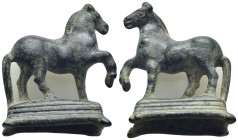Bronze figure of an advancing horse with foreleg raised on a socle base with short splayed legs (42mm, 40.3 g)