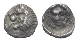 CARIA. Mylasa. Circa 420-390 BC. Tetartemorion (Silver, 6.24 mm, 0.19 g). Head of roaring lion to left with protruding tongue. Rev. Male head (Apollo)...