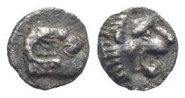 CARIA. Uncertain mint (Halikarnassos ?). Circa 420-400 BC. Tetartemorion (Silver, 5.88 mm, 0.22 g). Head of ram to right. Rev. Head of roaring lion to...
