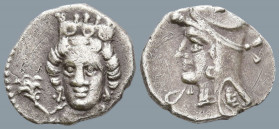 CILICIA. Uncertain. (4th century BC)
Obv: Female head facing slightly left, wearing stephane; rose to left.
Rev: Male head left, wearing diadem and ...