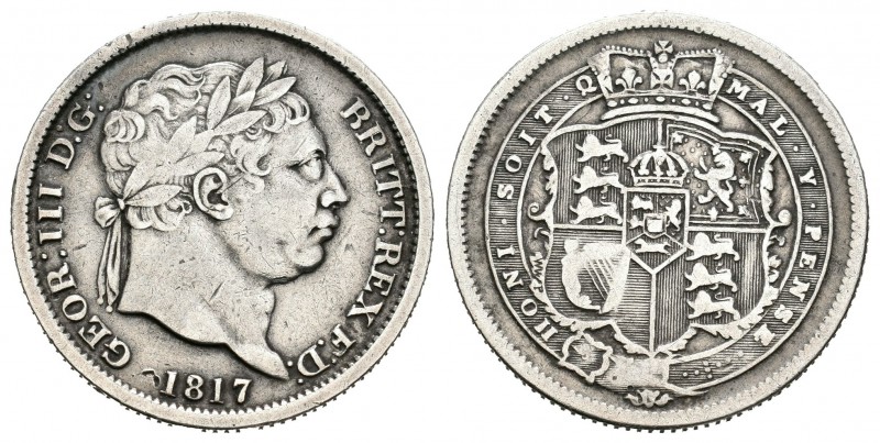 Gran Bretaña. George III. 1 shilling. 1817. (Km-666). Ag. 5,45 g. Canto estriado...