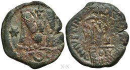 HERACLIUS, with HERACLIUS CONSTANTINE (610-641). Follis. Constantinople. Overstruck on a Constantinople mint Follis of Justinian I