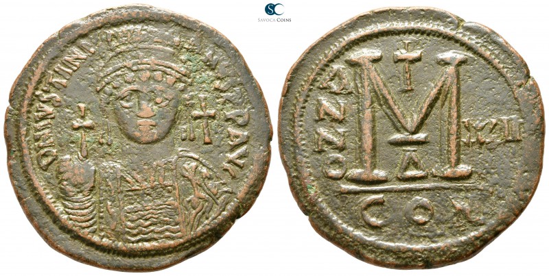 Justinian I AD 527-565. Constantinople
Follis Æ

38 mm., 21,94 g.

D N IVST...