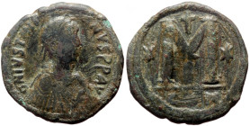 Follis AE
Justinian I (527-565), Constantinople, 527-538, Pearl-diademed, draped, and cuirassed bust right / Large M; cross above, stars flanking; B//...