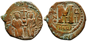 JUSTIN II (565-578). Follis. Antioch. 
Obv: D N IVSTINOS T N u.
Justin and Sophia seated facing on double throne, holding globus cruciger and each hol...