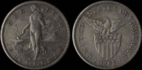 PHILIPPINES: 1 Peso (1907) in silver (0,800). Female standing beside hammer and anvil on obverse. Eagle above stars and striped shield on reverse. Scr...