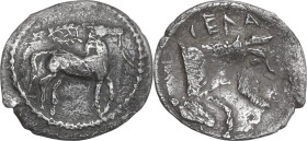 Sicily. Gela. AR Litra, 465-450 BC. Obv. Bridled horse standing right; above, wreath. Rev. Forepart of man-headed bull right. HGC 2 373. AR. 0.46 g. 1...