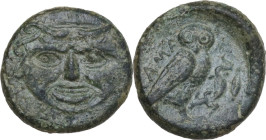 Sicily. Kamarina. AE Onkia, 425-405 BC. Obv. Gorgoneion. Rev. Owl standing right, head facing, wings closed, holding lizard; to right, corn of grain. ...