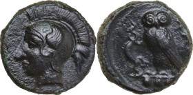 Sicily. Kamarina. AE Tetras or Trionkion, c. 410-405 BC. Obv. Head of Athena left, wearing crested Corinthian helmet decorated with a wing. Rev. KAMA....